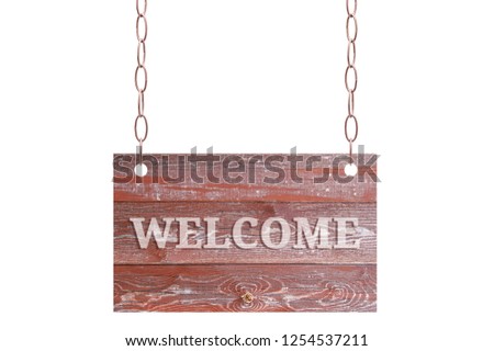 A wooden plate of worn brown boards hangs on a metal chain. White isolate With welcome sign.