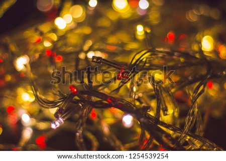 Christmas background with blue lights and copy space. Background with christmas lights. Christmas garland. New Year. Bokeh