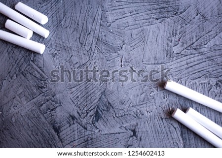 White chalk for school on gray background