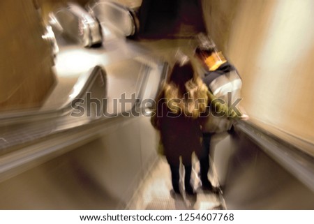 Tribute to Monet, impressionist photograph of the people in a creative photography of escalators, photographic sweeps at low shutter speed, blurred background, motion sensation, Toledo, Spain,