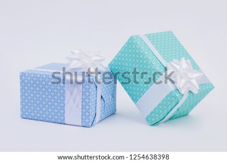 Gift boxes wrapped in blue paper. Blue and turquoise present box with white ribbon. Gifts for Saint Valentines Day.