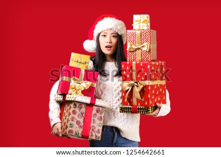 Beautiful smiling asian woman wearing knitted sweater celebrating Christmas. Portrait of attractive brunette casual female at new years eve. Background, copy space, close up.