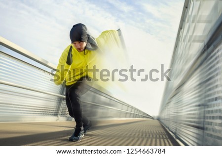 Abstract photo of man running along bridge. Exercising, Jogging, Sport, speed. Male athlete running fast.