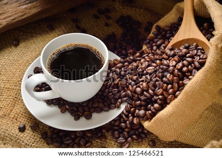 Coffee cup and coffee beans Royalty-Free Stock Photo #125466521