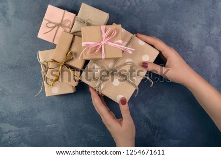 Conceptual photo of a Christmas gifts with gifts on a beton background.