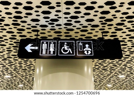 Airport White Colored Restroom Sign for Disabled and Babies on Black Board