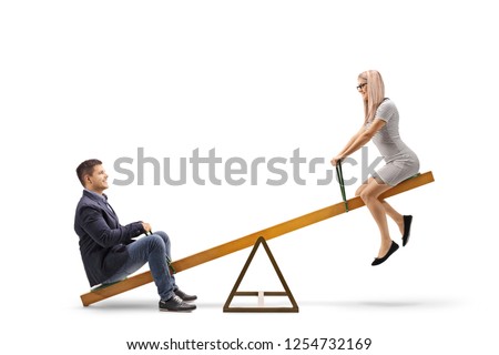 Young couple riding on a seesaw isolated on white background