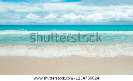 Vacation travel holiday recreation on beach concept.  yellow warm sand and summer sea with sky and free space