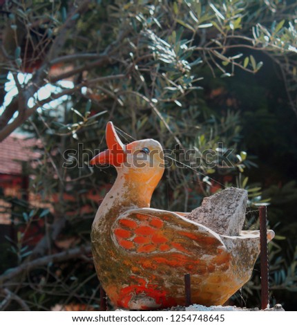 Decoration statuette of duck on the fence of a house in village of Orma,Edessa,Greece.2018 Oct