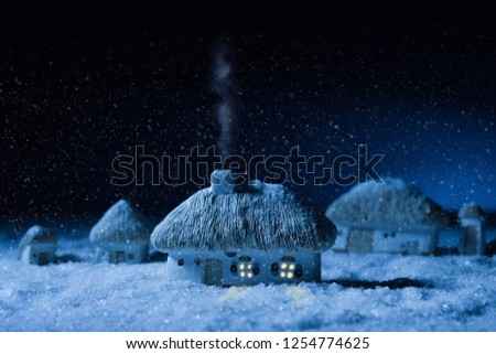 Night photo of winter christmas, fairy toy village