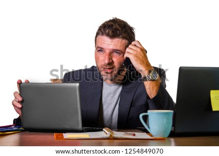 young attractive upset and stressed businessman working overwhelmed suffering stress at office computer desk in corporate business job problem isolated on white background