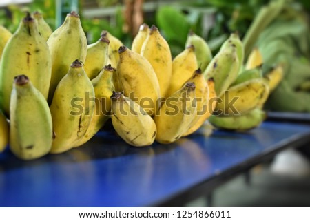 Bananas on a blue table.