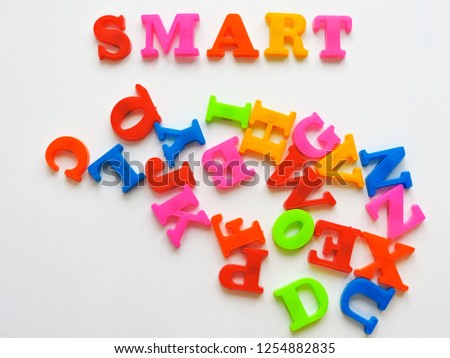  Magnetic Plastic ABC Letters Isolated. Colorful plastic English alphabet on a white  background. Learning english concept.kid is Learning the alphabets at home. 