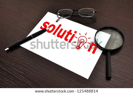 workplace with solution symbol on paper
