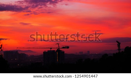 Silhouette of construction in twilight sky