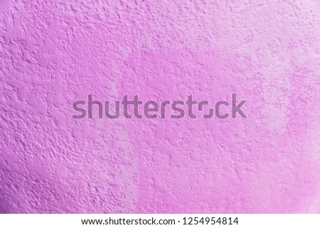 bright purple concrete background tecture lit by the sun