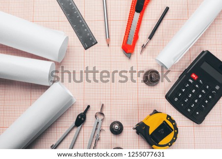 drawing tools on red graph paper with copy space