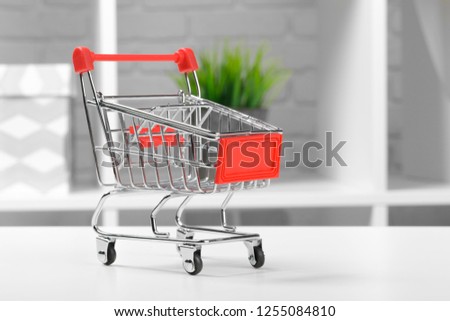 Mini Shopping Cart On The Table.