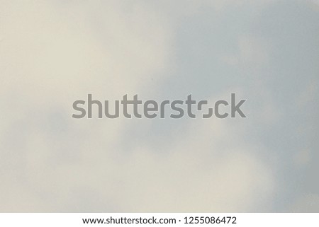Faded and vintage tone of clouds in the blue sky for decoration and grunge background
