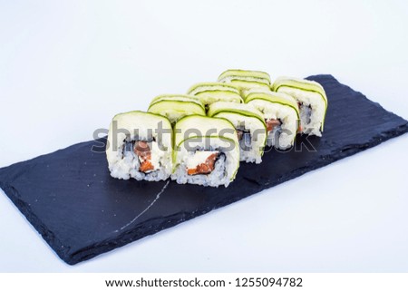Sushi with sesame fish and cheese served on a plate