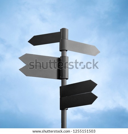 Empty dark metal signpost isolated on sky background