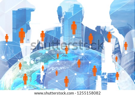 Silhouettes of managers working in modern city with double exposure of Earth hologram and people network. Global world concept. Elements of this image furnished by NASA