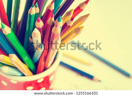 Multicolored pencils, close up.
