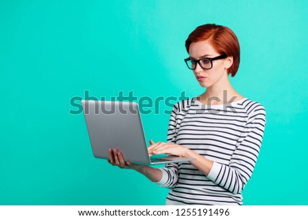 Side half turned profile portrait photo of smart intelligent nerd geek online consultant customer using holding pad on hand isolated bright color teal background