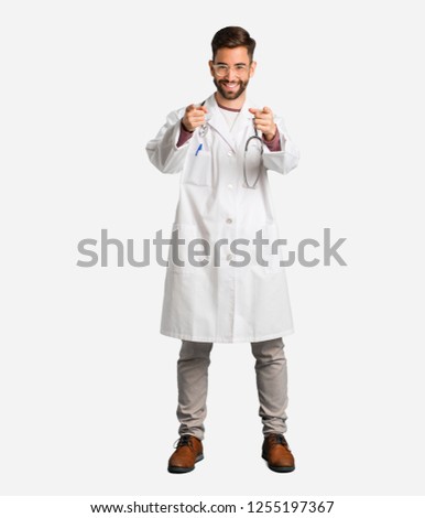 Young doctor man cheerful and smiling