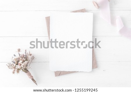 Feminine wedding, birthday desktop mock-up. Invitation card mockup, template Blank greeting cards, rspv card, 5x7, card, craft envelope. Silk ribbons, pink, dry flowers. White wooden background. Flat