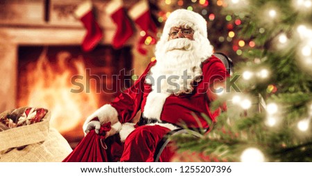 Red old Santa Claus and home interior with fireplace and christmas tree 