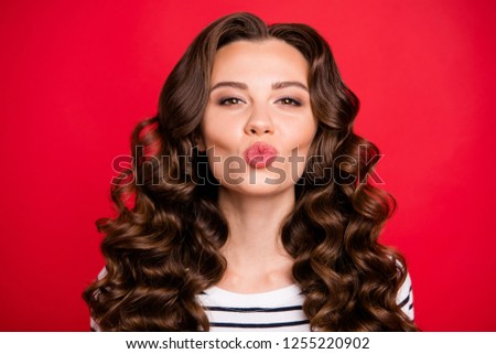 Close up photo of fashionable attractive cute gorgeous she her lady sending rose lips kiss wearing white striped pullover isolated on red vivid background