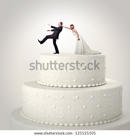 3d wedding cake and funny couple situation Royalty-Free Stock Photo #125525105