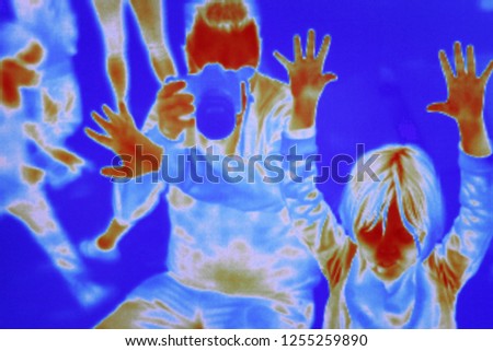 Infrared camera highlighting warm zones on the human body