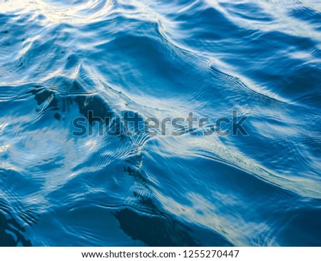 Close up picture of sea wave. Blue sea water with ripple.
