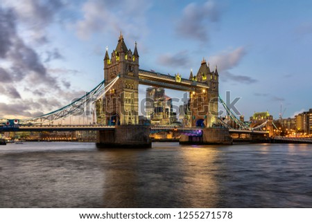 View to the illuminated Tower Bridge in London during a colourful winter sunset, UK