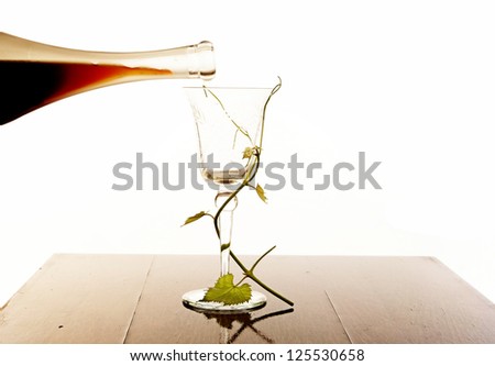 Red wine pouring down from a wine bottle