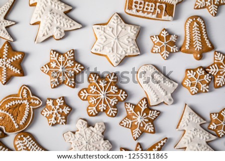 Big set Christmas gingerbread: gingerbread houses, crescent, gingerbread man, snowflakes, sock, Christmas tree, bell, star, new year's ball on white background