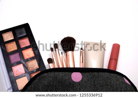 Eyes Shadow in Make up Cosmetics bag and set of professional decorative, makeup tools and accessory on white background. beauty, fashion and shopping concept