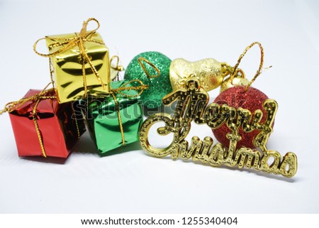 Merry Christmas photo on white background with ball,bell and gift box.