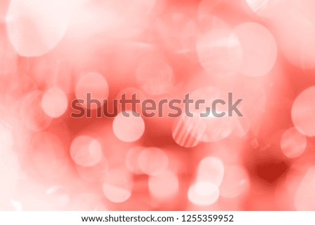colorful bokeh on blurred background. Color of the year living coral 2019