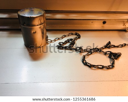Salt shaker on a chain