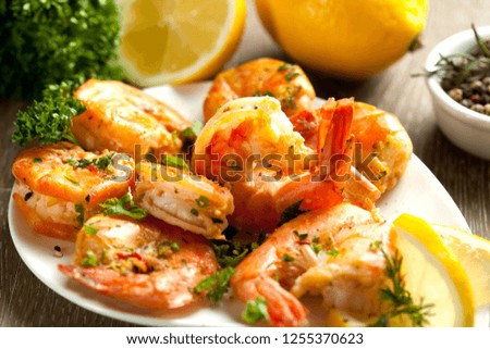 Fried prawns with fresh rosmarin and lemon juice