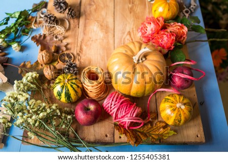 beautiful autumn composition with a pumpkin  on the wooden table