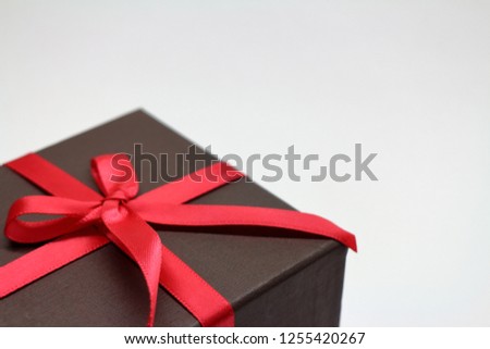 A red ribbon gift box