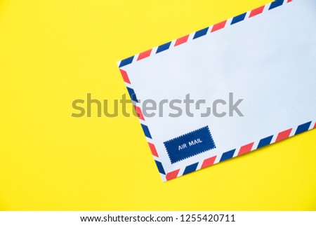 air mail envelope on yellow background