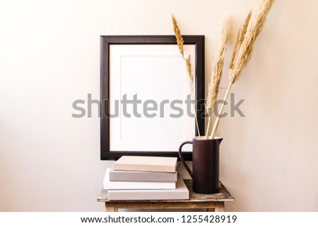 Empty wooden frame mockup. Interior poster design on white wall