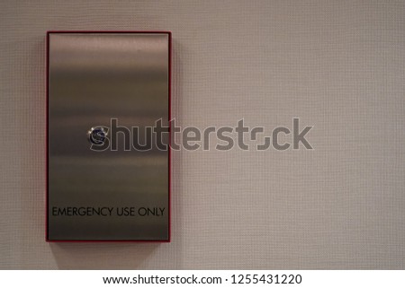 An elevator lock box for emergency use only, with room for text on the side