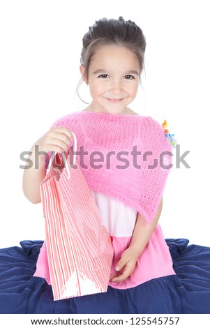 Picture of beautiful smiling little girl with pink shopping bags over white background