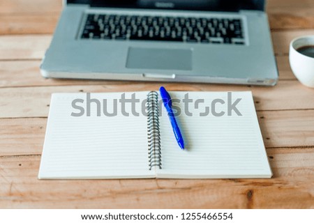 A desk with a business computer and a note on the desk. Business concept with copy space.